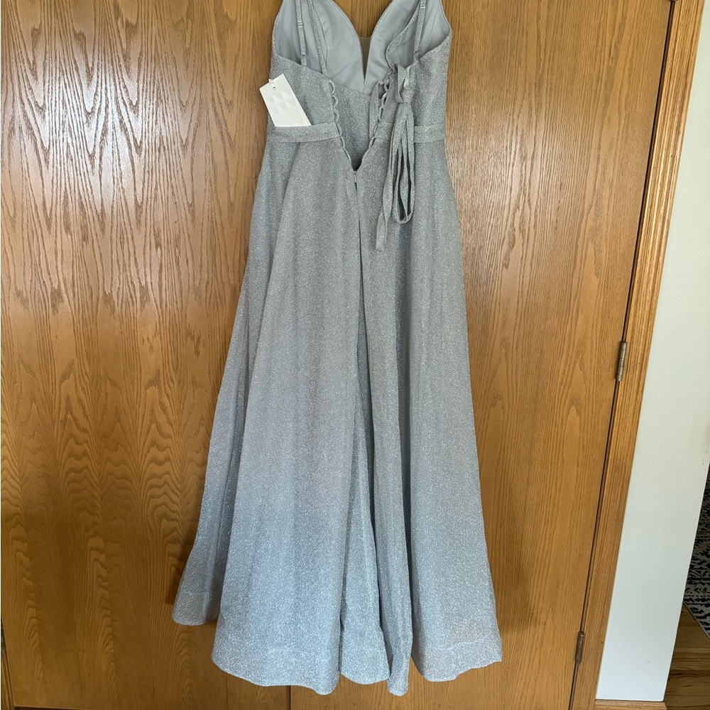 Sliver corset Prom dress never worn and still has tags size 10